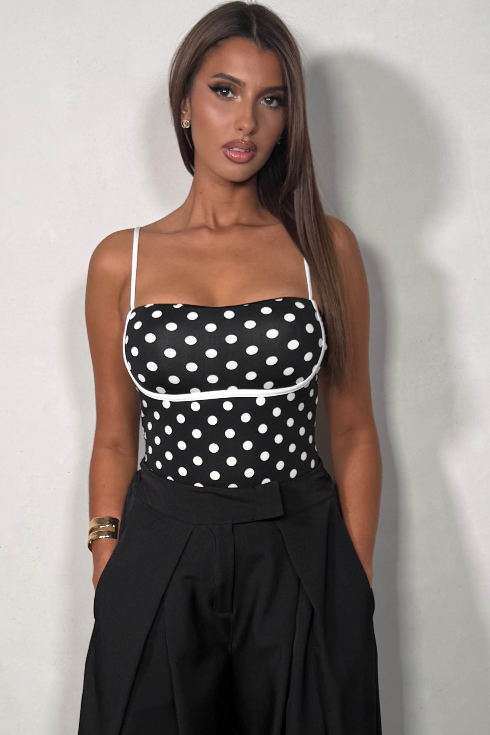 Body femme à pois fines bretelles coloris noir